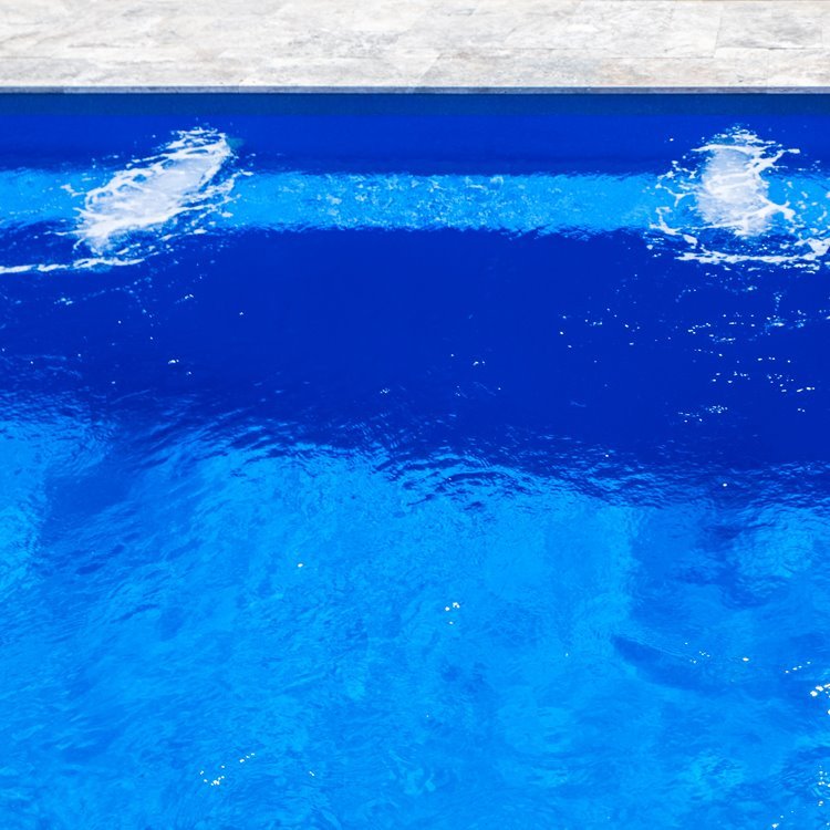 Close-up of the shimmering marble-look pool water
